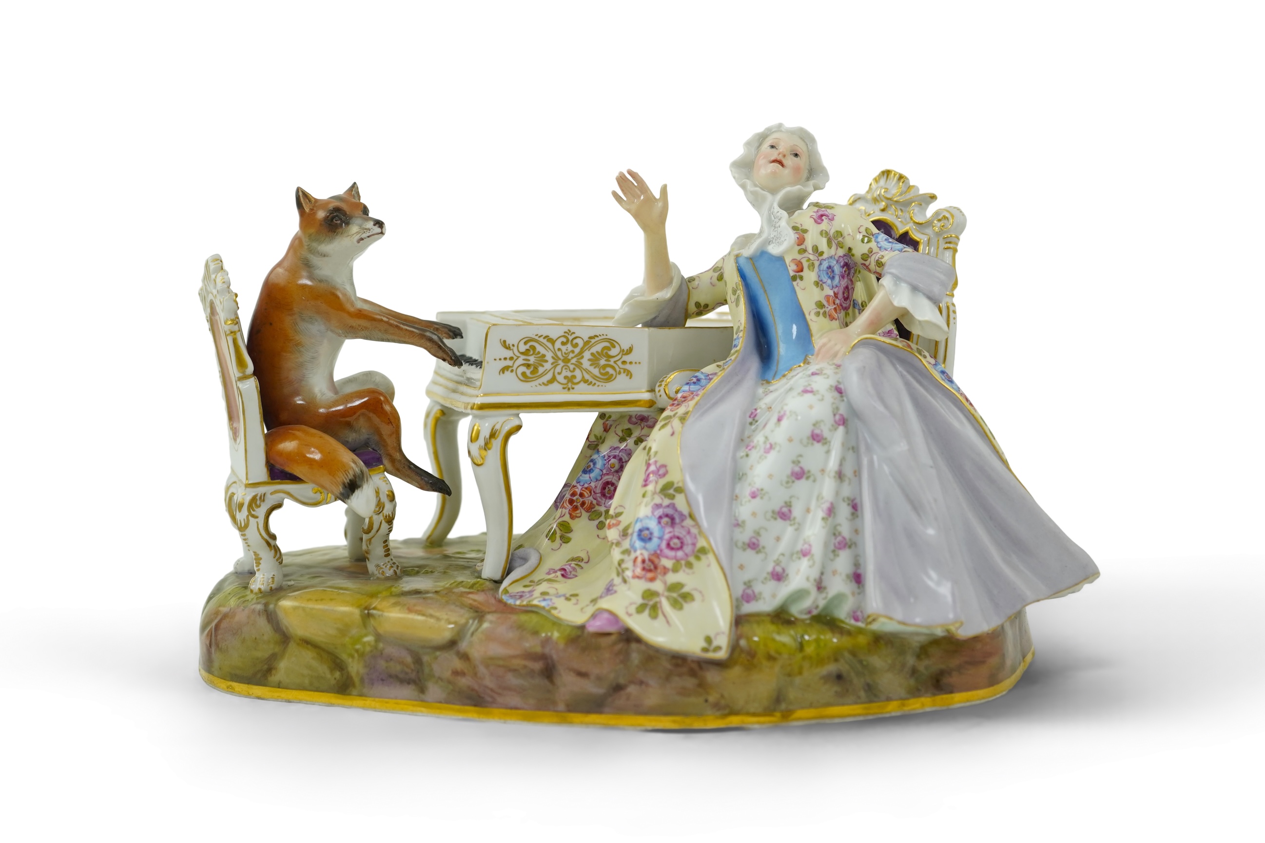 A Meissen group of a fox at the piano and a lady listening, after J. J. Kandler, late 19th century
